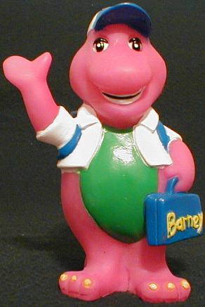 This is a 7.25" hard vinyl bank showing Barney as a schoolboy who is waving 